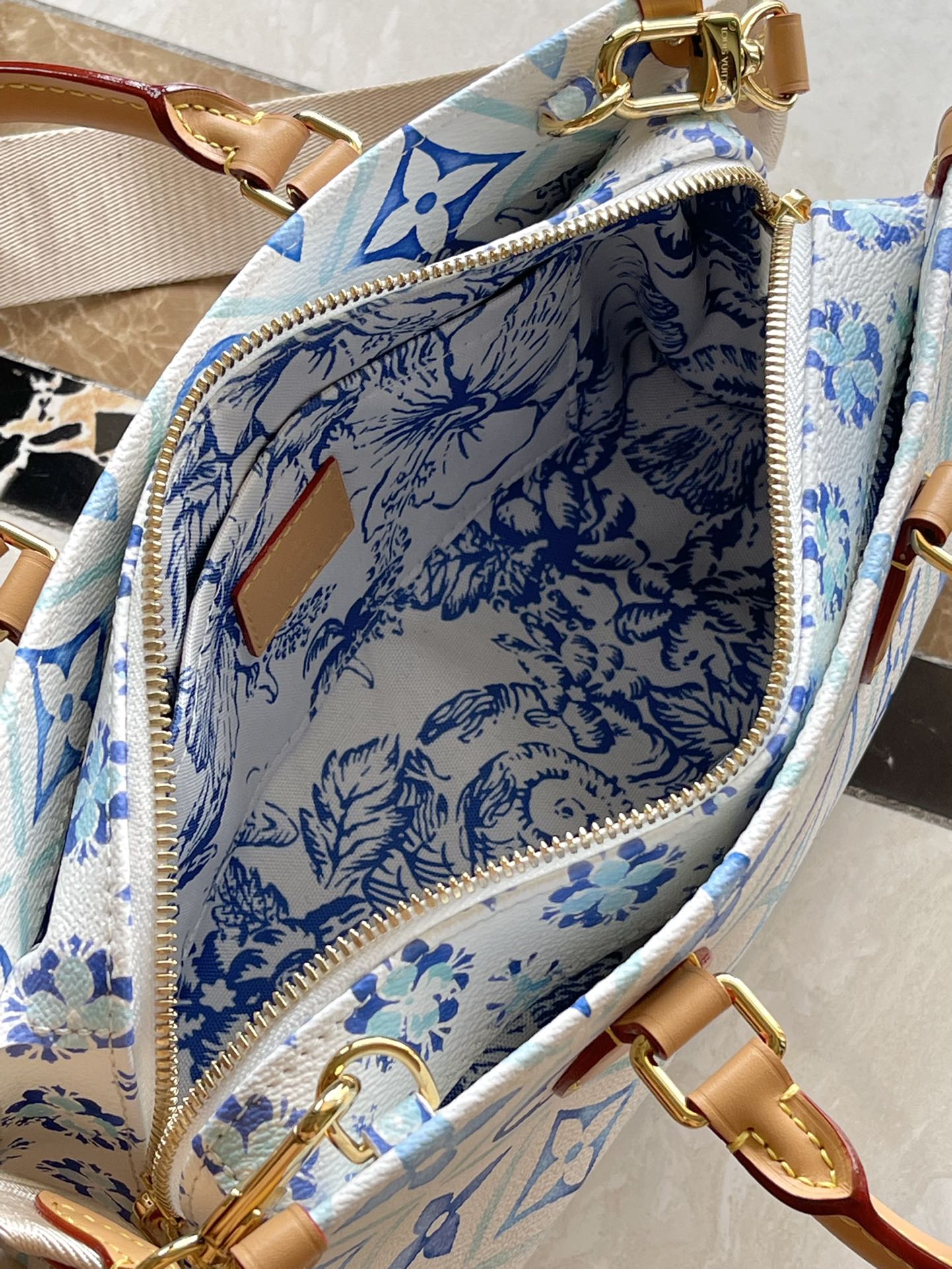 LOUIS VUITTON ONTHEGO EAST WEST 25 IN LAGOON BLUE MONOGRAM TILES CANVAS