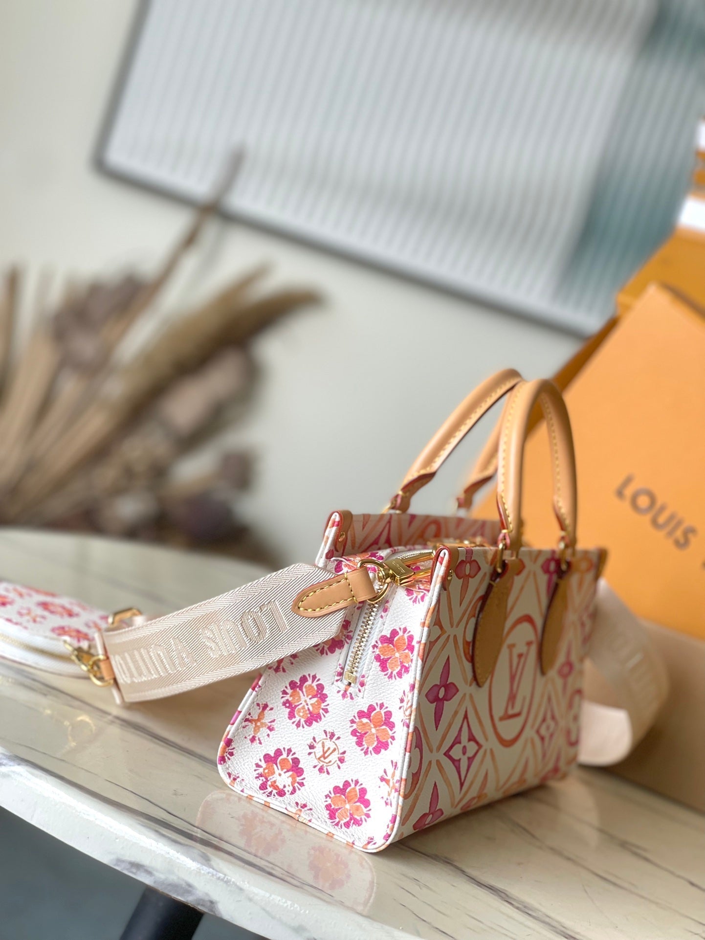 LOUIS VUITTON ONTHEGO EAST WEST 25 IN CORAL MONOGRAM TILES CANVAS