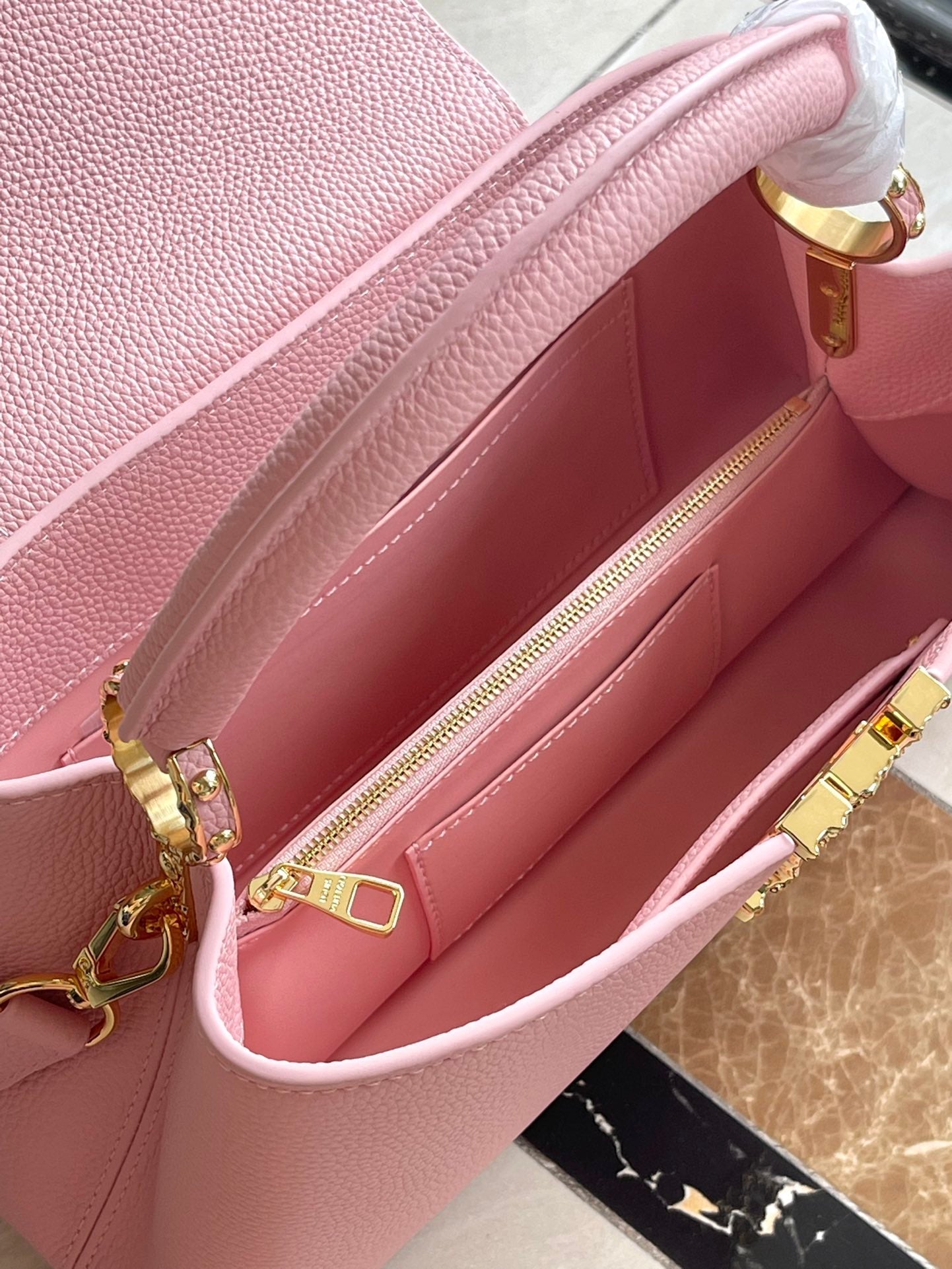 LOUIS VUITTON CAPUCINES EAST-WEST 33 IN BLUSH PINK CALFSKIN GOLD HARDWARE