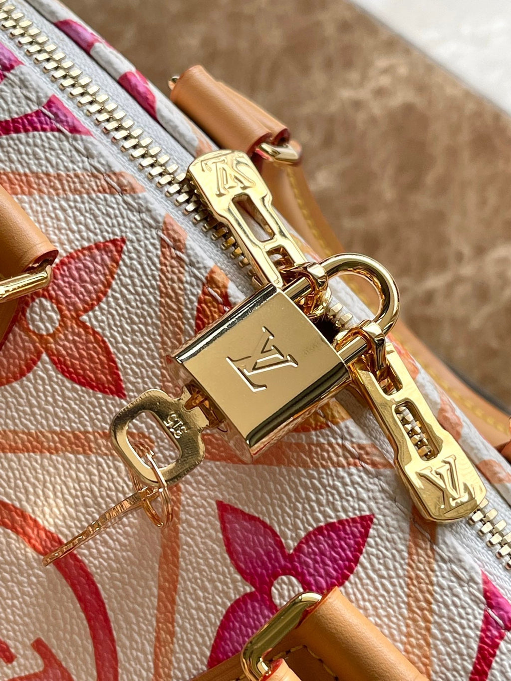 LOUIS VUITTON SPEEDY BANDOULIÈRE 20 IN CORAL MONOGRAM TILES CANVAS GOLD BUCKLE