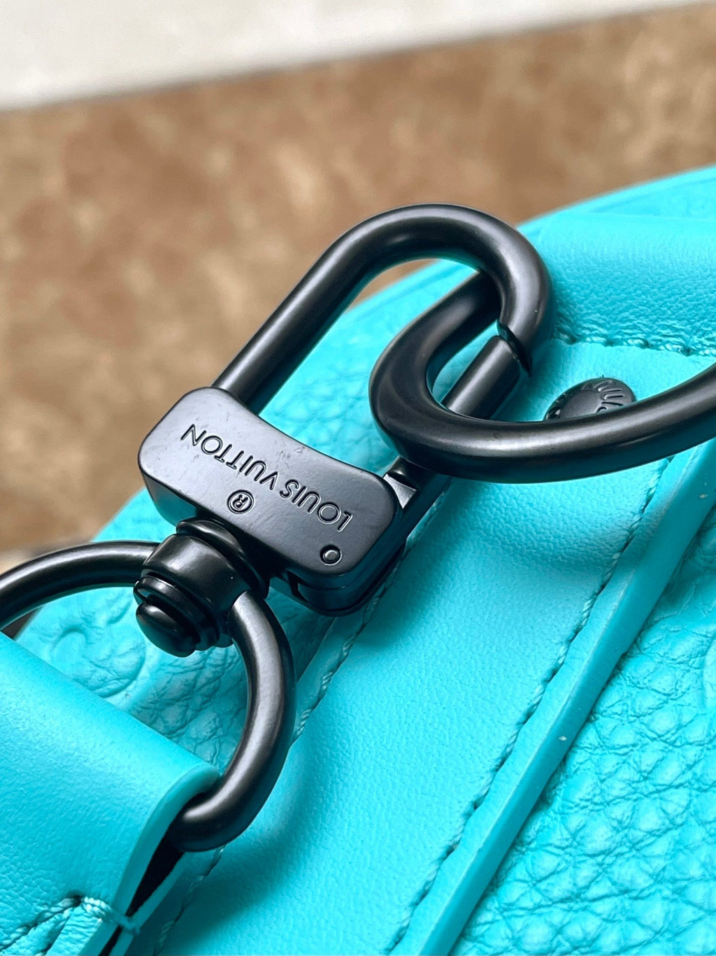 LOUIS VUITTON KEEPALL BANDOULIÈRE 25 IN TURQUOISE BLUE MONOGRAM EMBOSSED CALFSKIN
