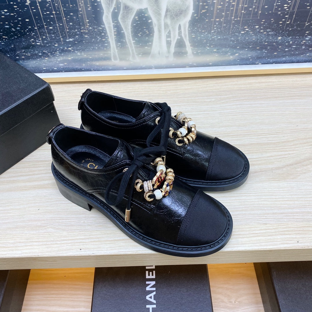 CHANEL COMBAT OXFORD SHOES IN BLACK WRINKLED CALFSKIN AND GROSGRAIN WITH FAUX PEARL