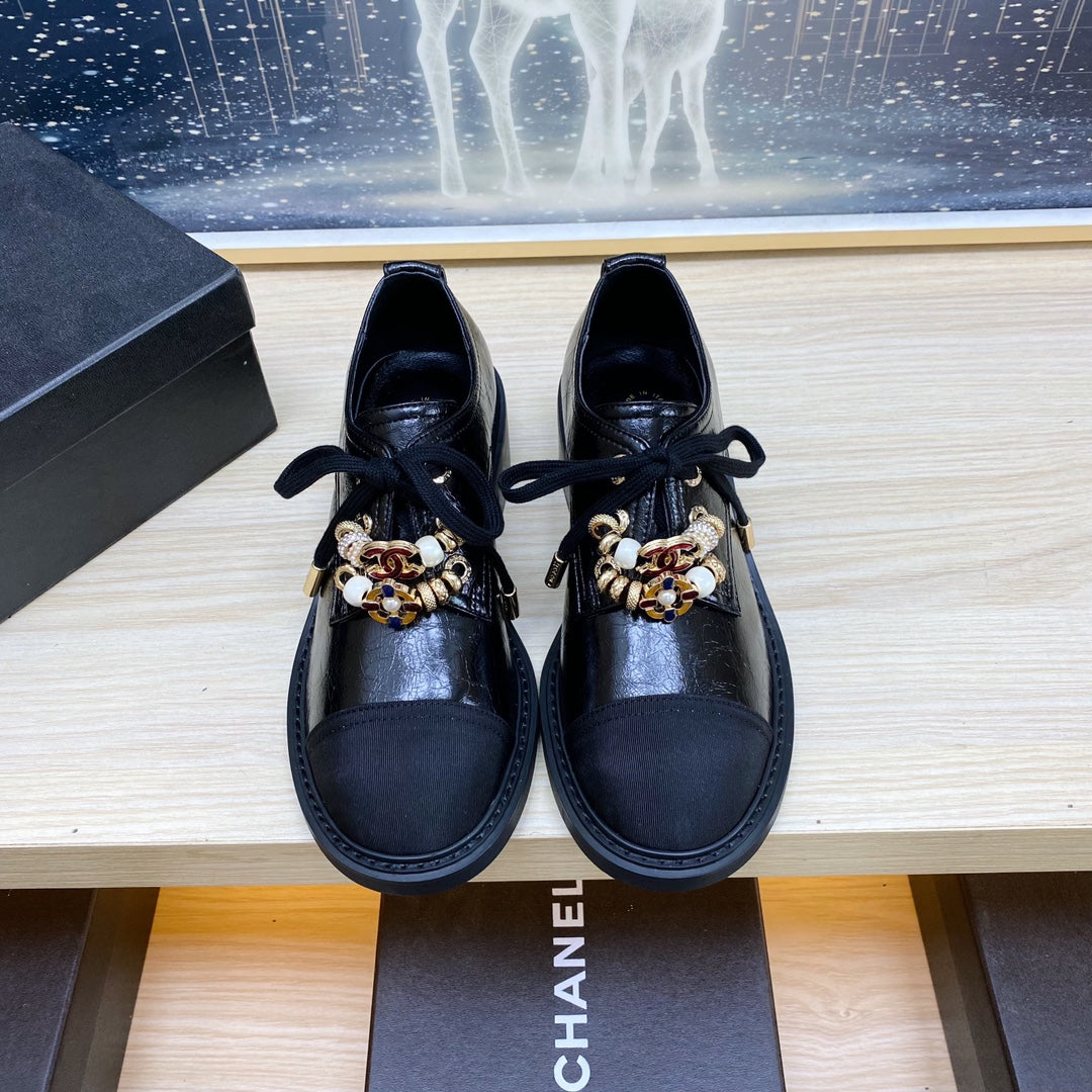 CHANEL COMBAT OXFORD SHOES IN BLACK WRINKLED CALFSKIN AND GROSGRAIN WITH FAUX PEARL