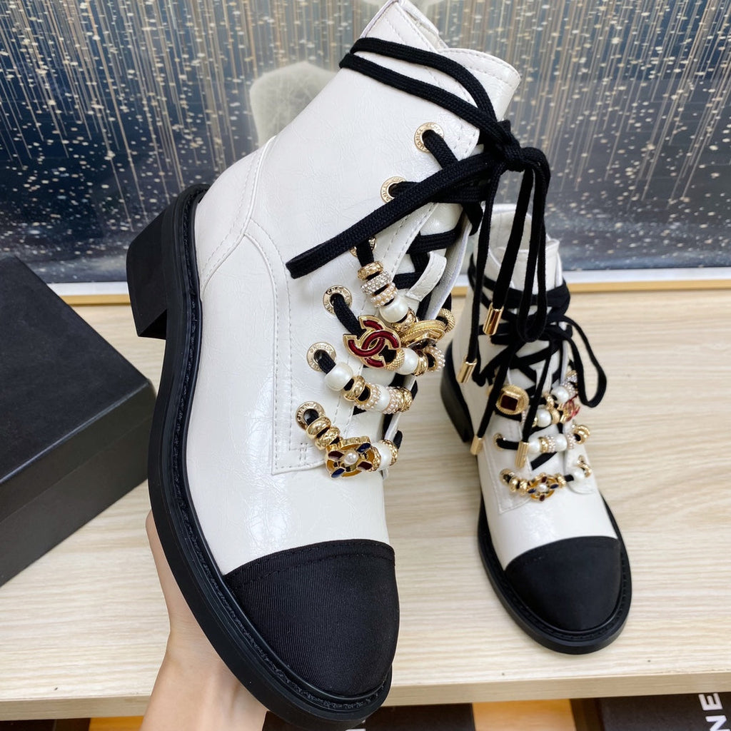 CHANEL COMBAT BOOTS IN WHITE WRINKLED CALFSKIN AND BLACK GROSGRAIN WITH FAUX PEARL