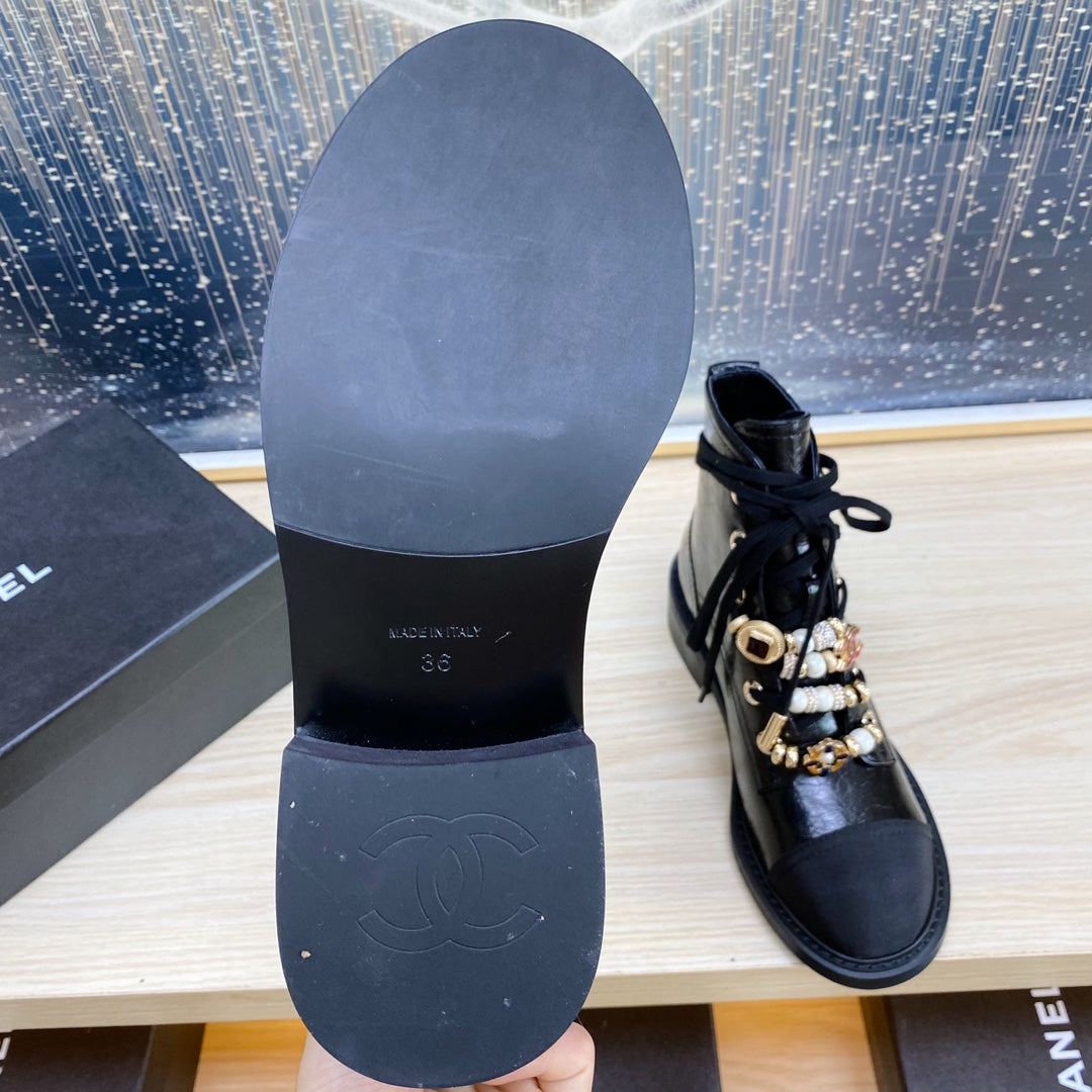 CHANEL COMBAT BOOTS IN BLACK WRINKLED CALFSKIN AND GROSGRAIN WITH FAUX PEARL