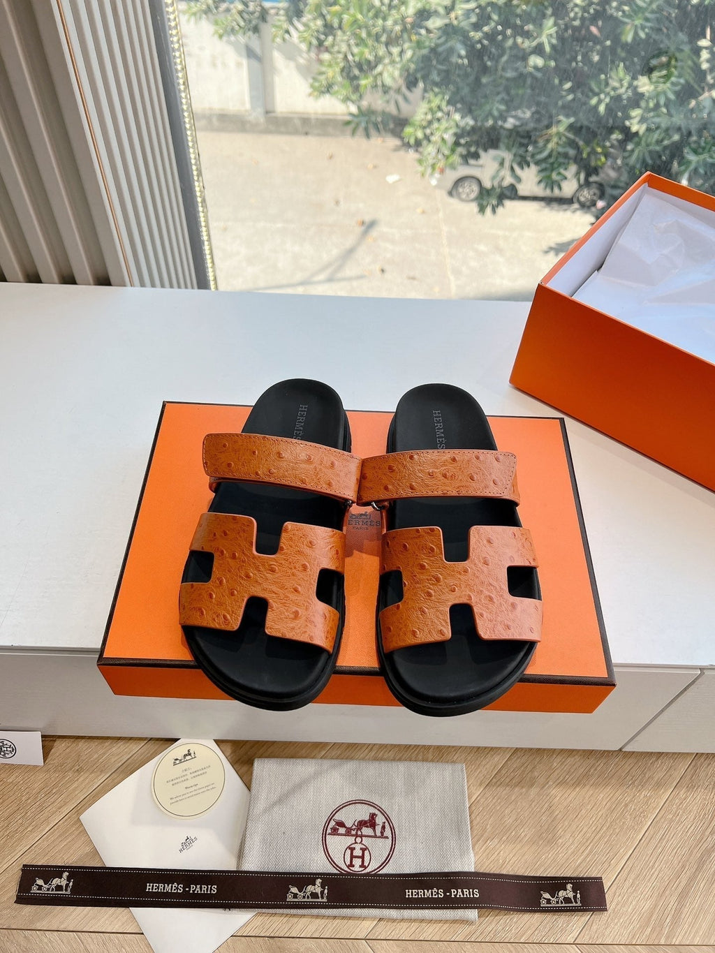 HERMES CHYPRE SANDAL IN VIVID ORANGE GRAINED CALFSKIN