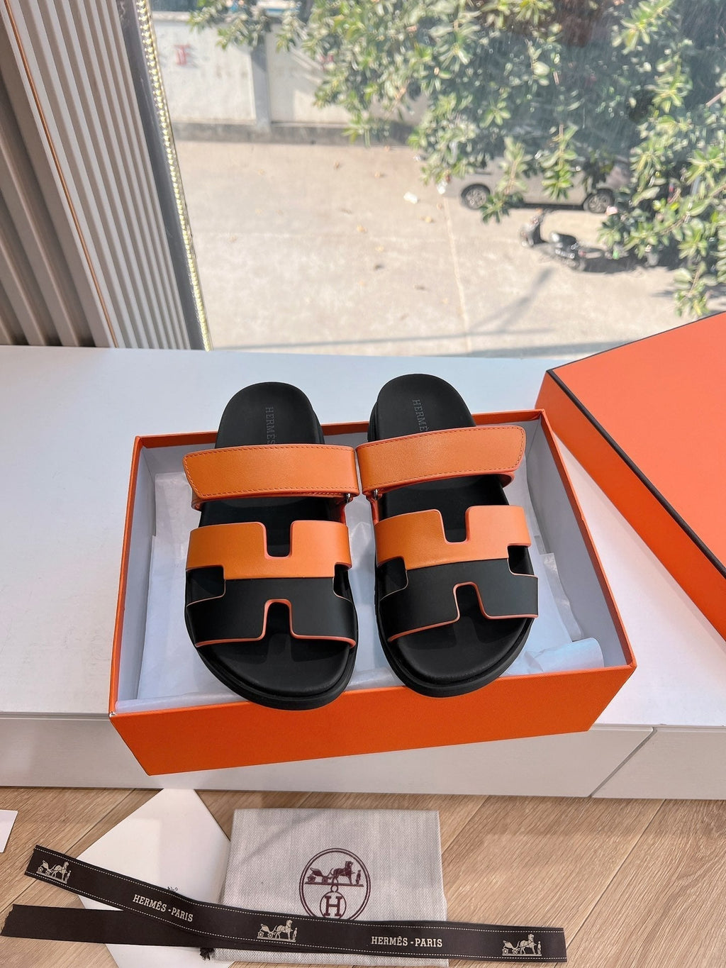 HERMES CHYPRE SANDAL IN VIVID ORANGE MIX BLACK CALFSKIN