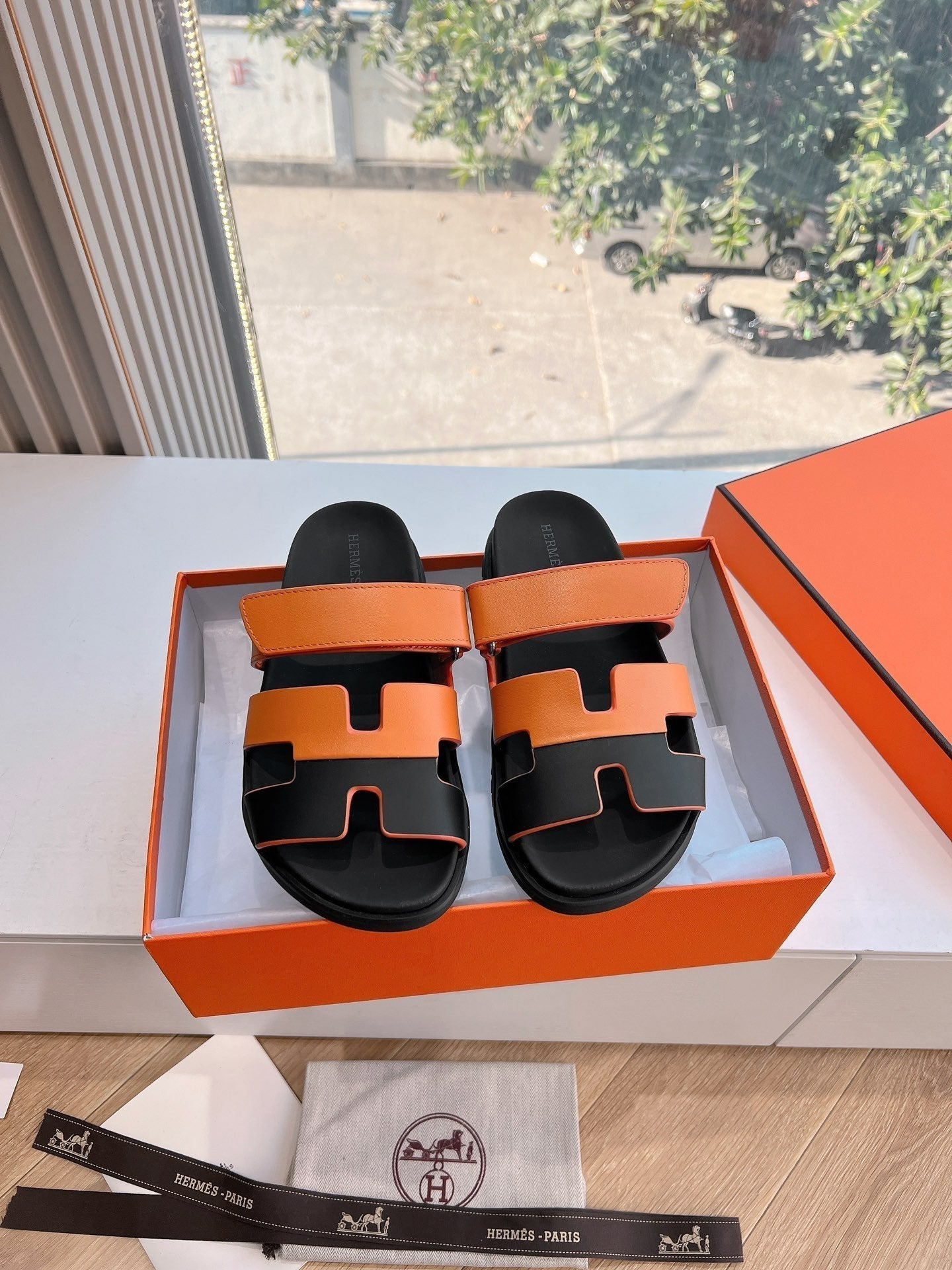 HERMES CHYPRE SANDAL IN VIVID ORANGE MIX BLACK CALFSKIN