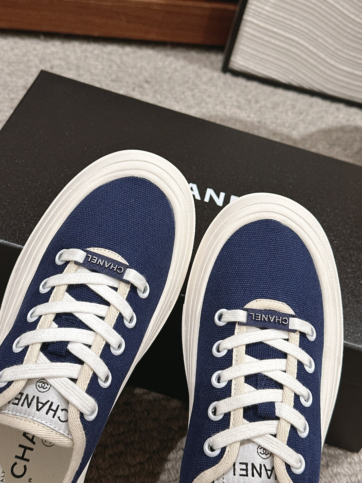 CHANEL LACE-UP SNEAKERS IN NAVY BLUE CANVAS
