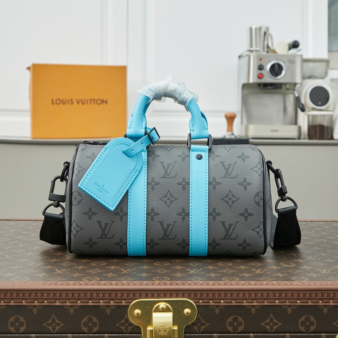 LOUIS VUITTON KEEPALL BANDOULIÈRE 25 IN GUN METAL MONOGRAM ECLIPSE CANVAS MIX TURQUOISE CALFSKIN
