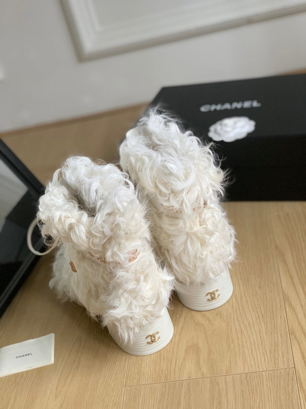 CHANEL ANKLE BOOTS IN WHITE MIX BLACK WOOL FUR