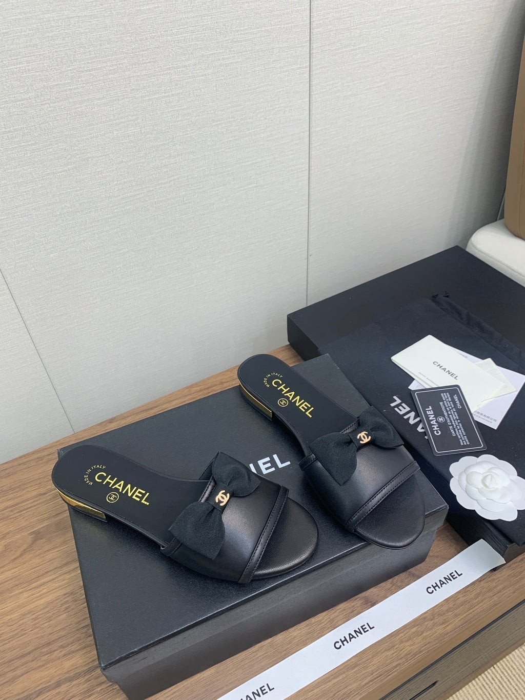 CHANEL BOW SLIPPERS IN BLACK LAMBSKIN
