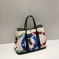 HERMES GARDEN PARTY 36 IN MULTICOLOR TOILE H CANVAS BLACK CALFSKIN OVERLAPPING POLKA RINGS PRINT