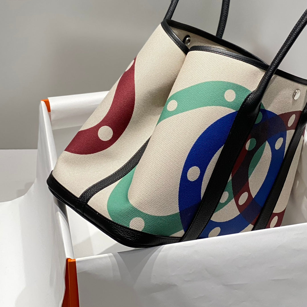 HERMES GARDEN PARTY 36 IN MULTICOLOR TOILE H CANVAS BLACK CALFSKIN OVERLAPPING POLKA RINGS PRINT