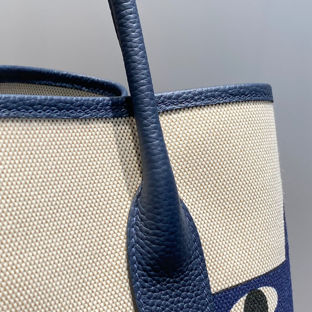 HERMES GARDEN PARTY 36 IN NAVY CREAM TOILE H CANVAS BLUE MARINE CALFSKIN ABSTRACT BEAR FACE PRINT