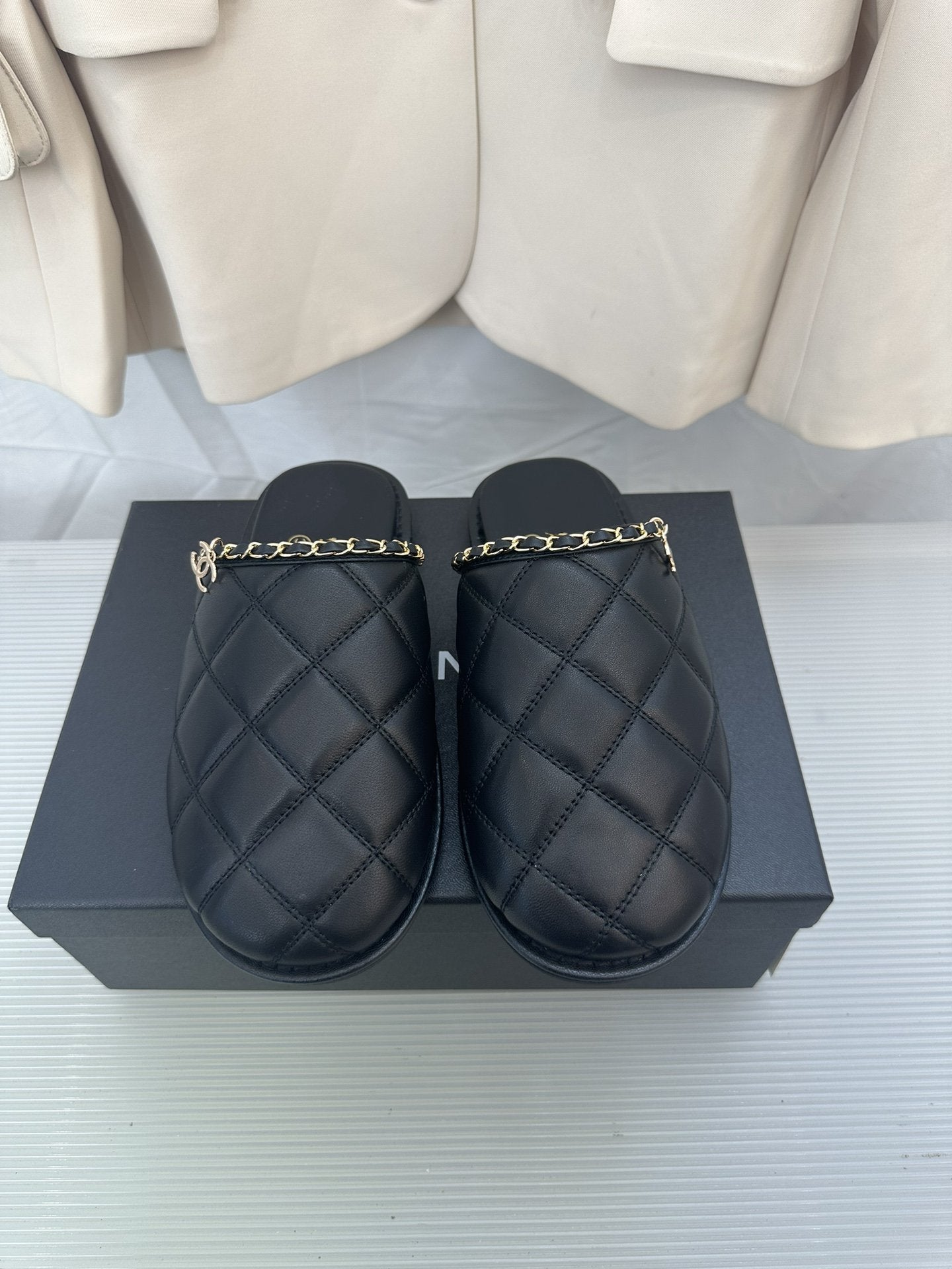 CHANEL Black Lambskin Gold Chain Mules