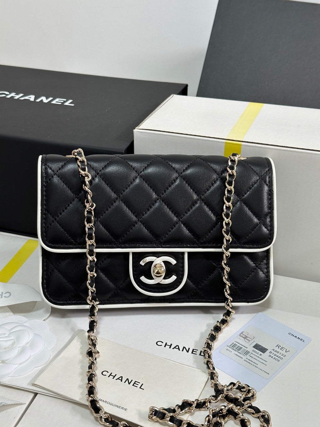 CHANEL QUILTED FLAP BAG WITH WHITE TRIM 19 IN BLACK LAMBSKIN
