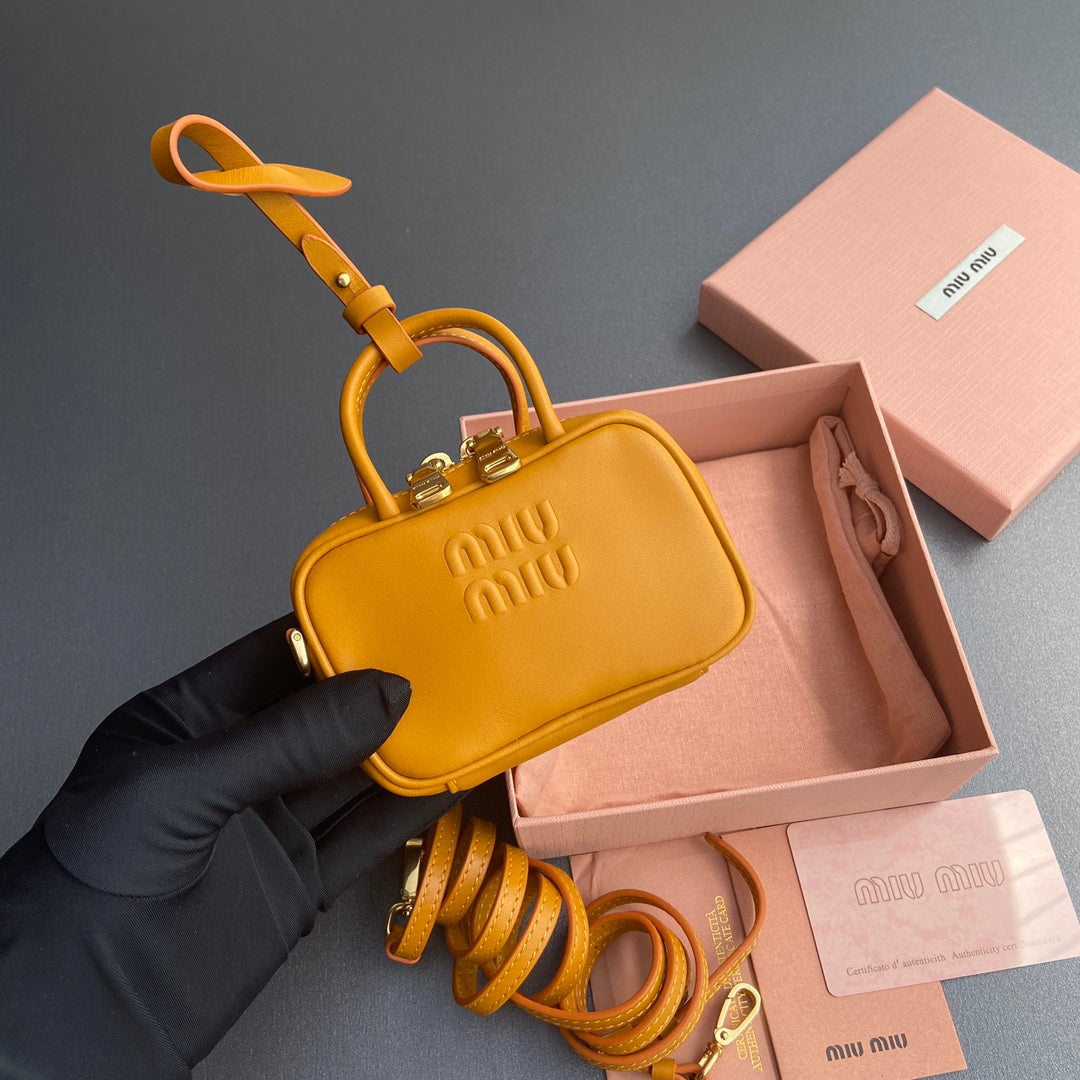 MICRO BAG KEYCHAIN 11 IN INDOCHINE ORANGE CALFSKIN EMBOSSED LOGO