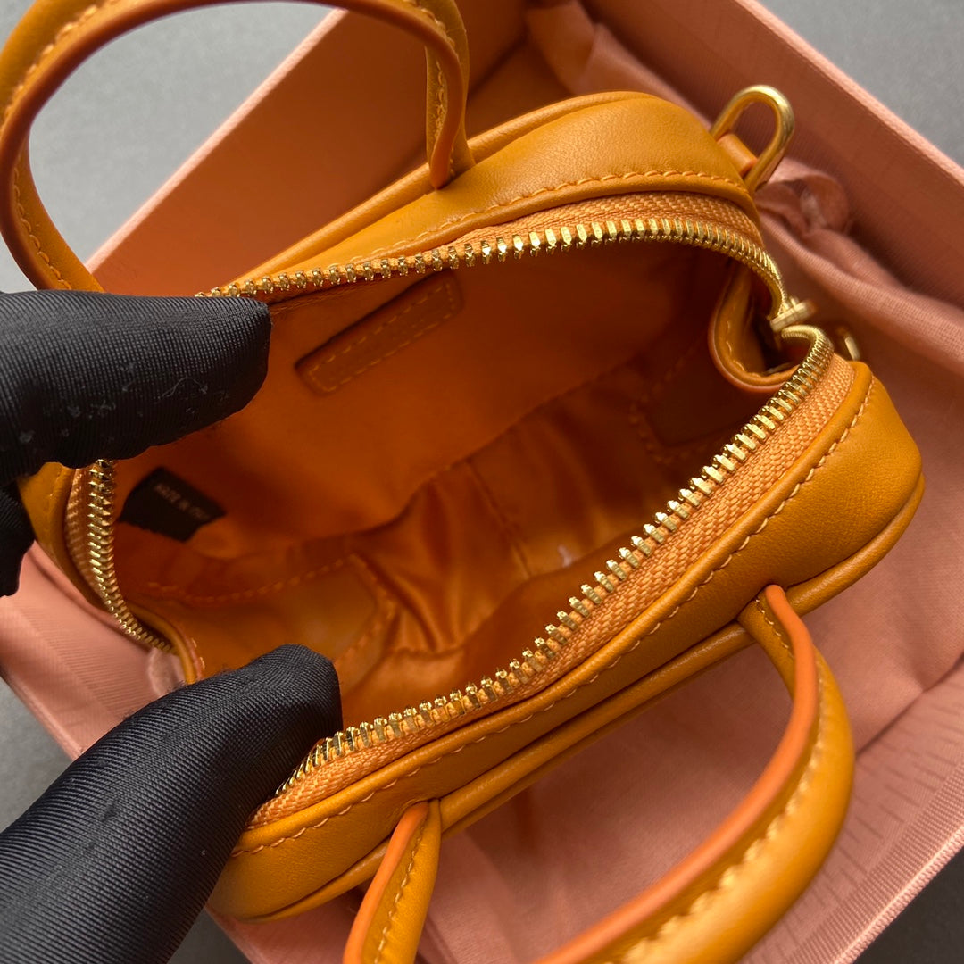 MICRO BAG KEYCHAIN 11 IN INDOCHINE ORANGE CALFSKIN EMBOSSED LOGO