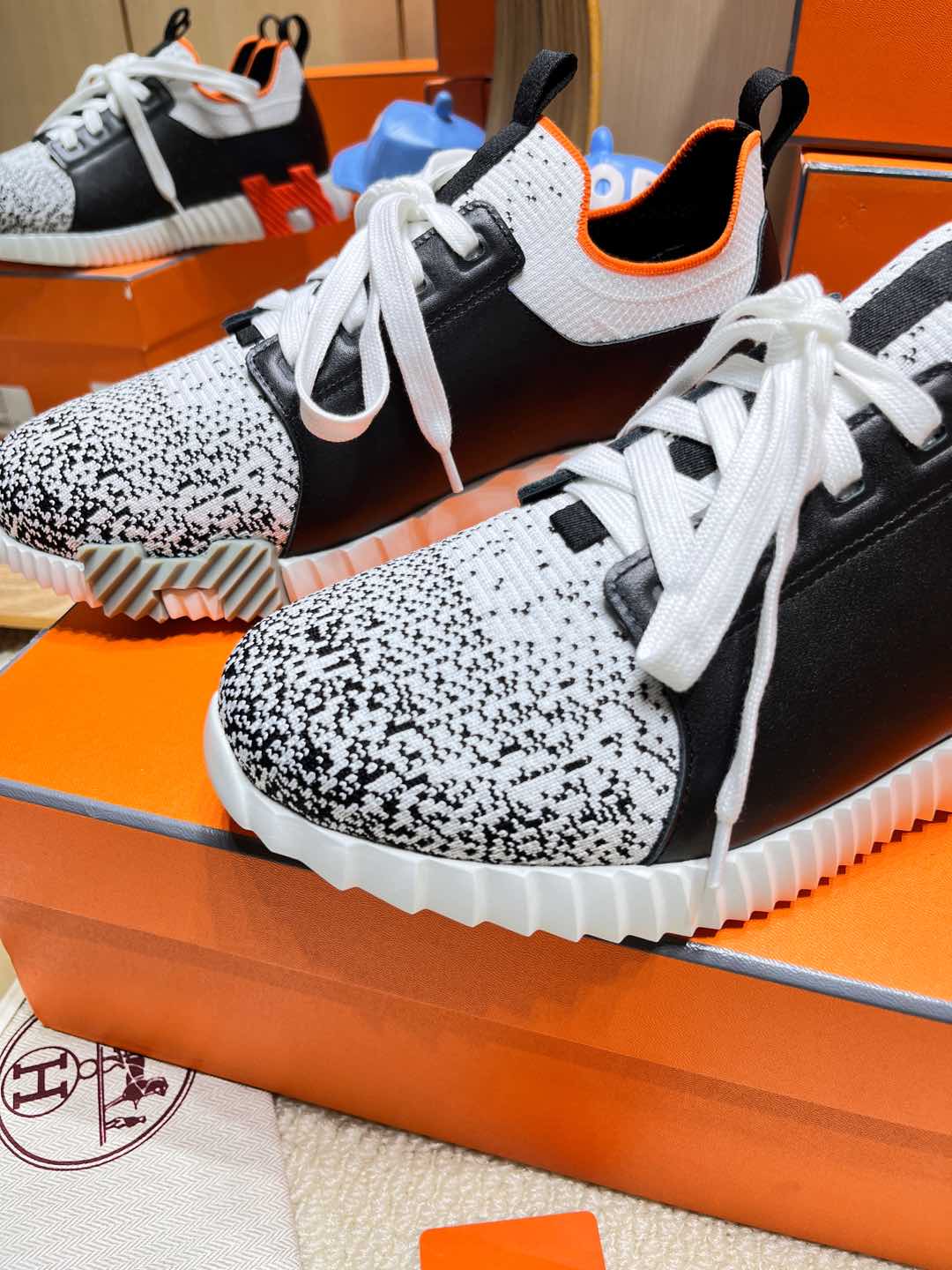 HERMES DEPART SLIP-ON SNEAKER IN WHITE MIX BLACK KNIT AND BLACK CALFSKIN