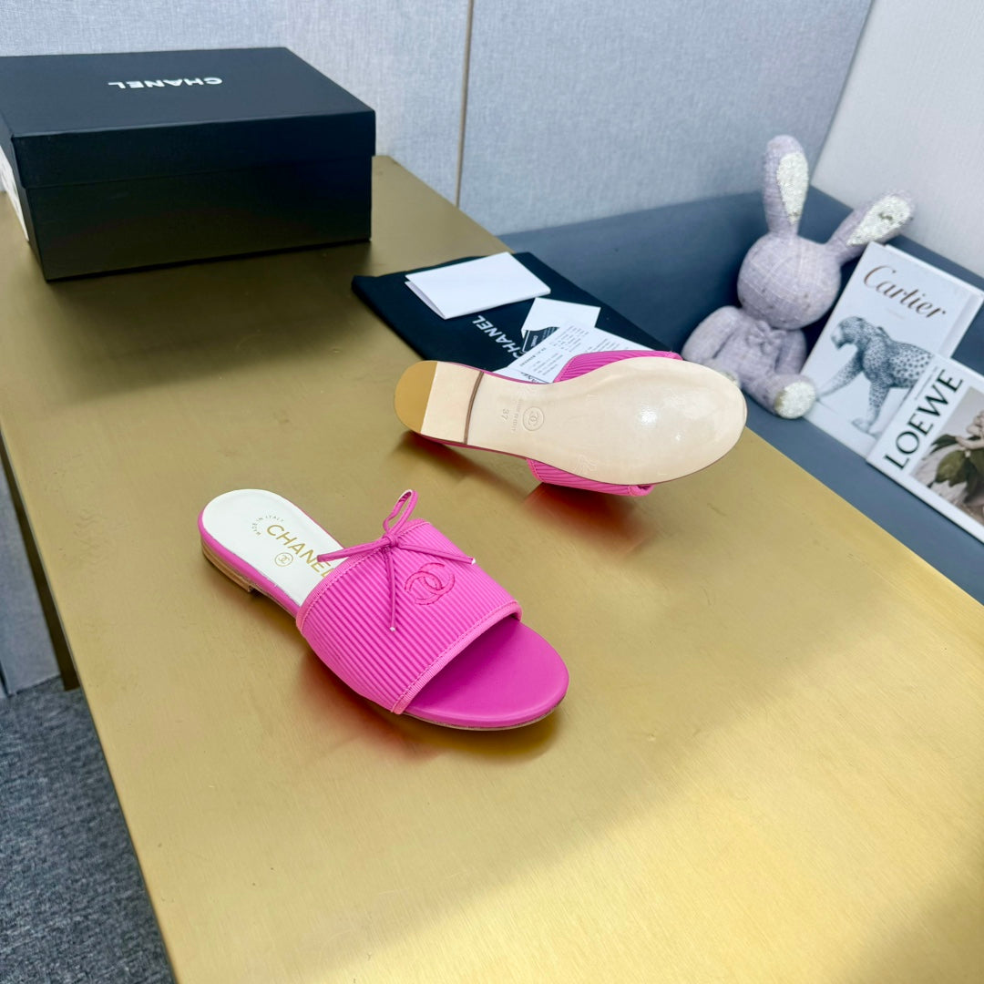 CHANEL BOW SLIPPERS IN BRIGHT PINK LAMBSKIN