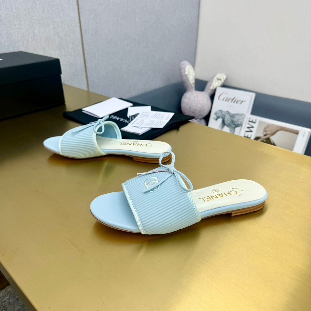 CHANEL BOW SLIPPERS IN LIGHT BLUE LAMBSKIN