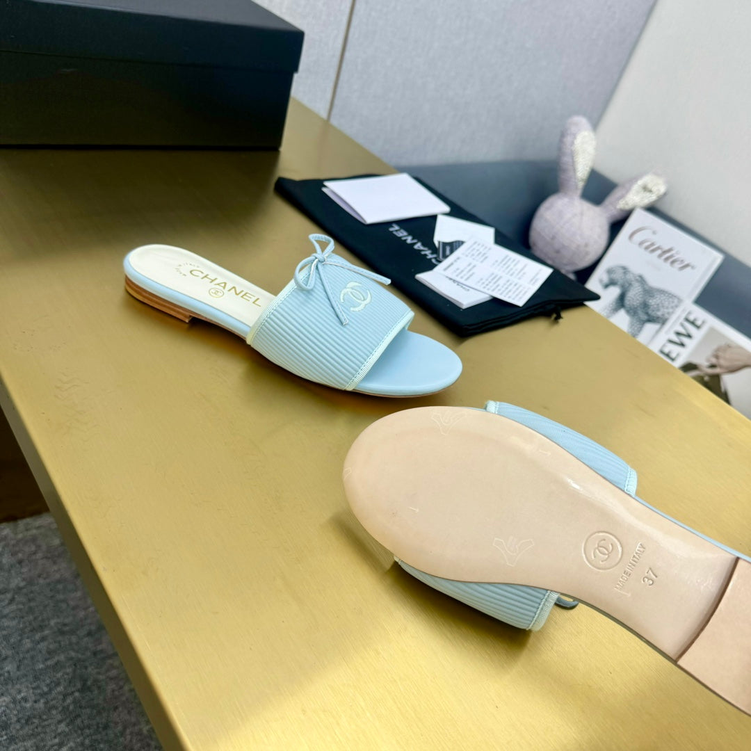 CHANEL BOW SLIPPERS IN LIGHT BLUE LAMBSKIN