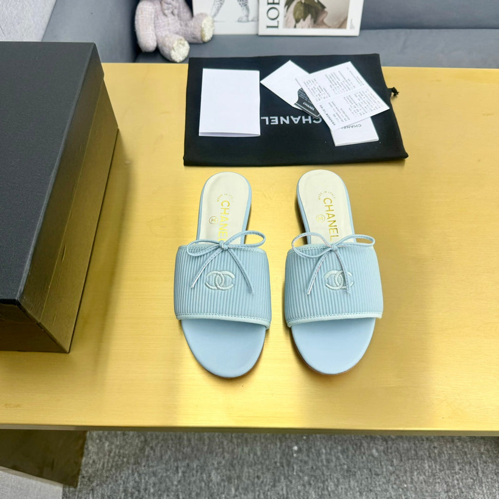 CHANEL BOW SLIPPERS IN LIGHT BLUE LAMBSKIN