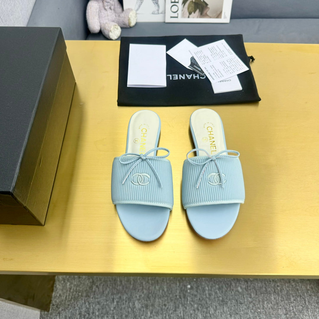 CHANEL BOW SLIPPERS IN LIGHT BLUE LAMBSKIN