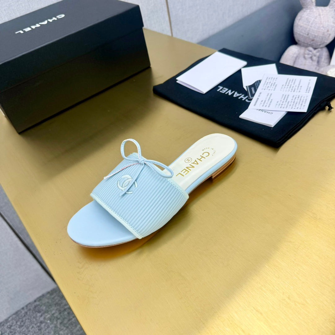 CHANEL BOW SLIPPERS IN LIGHT BLUE LAMBSKIN