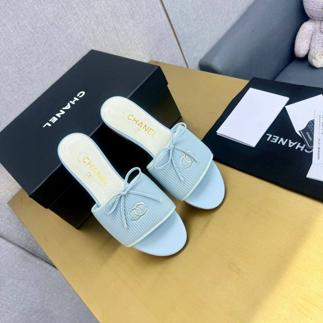 CHANEL BOW SLIPPERS IN LIGHT BLUE LAMBSKIN