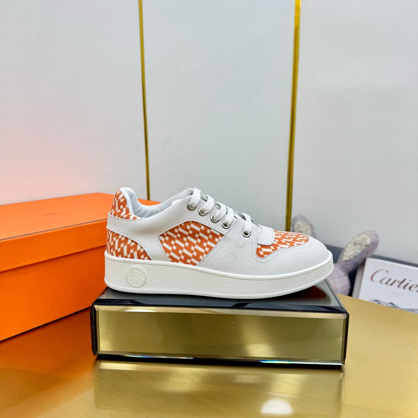 HERMES FREE SNEAKER IN WHITE CALFSKIN AND "H EN BIAIS" ORANGE CANVAS