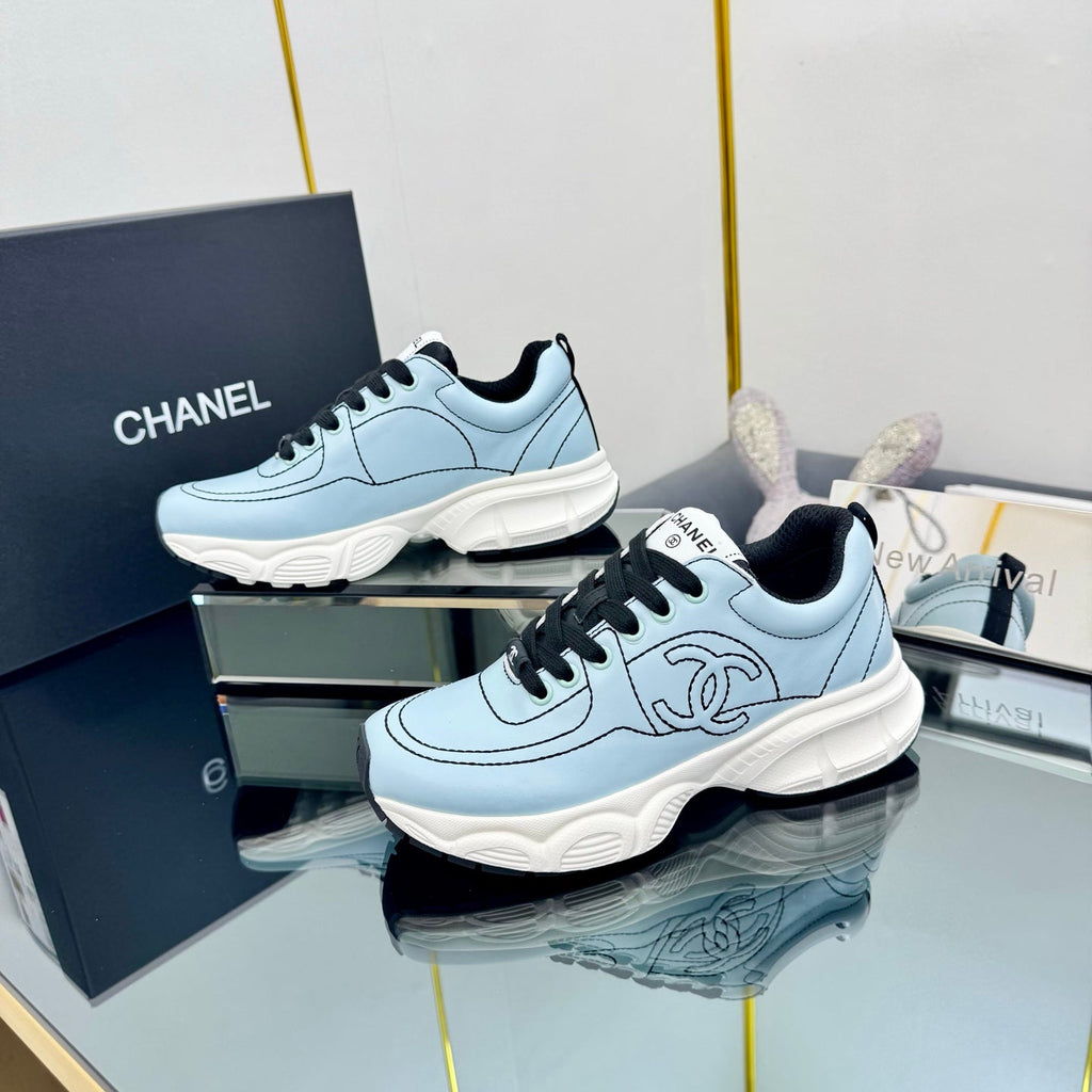 CHANEL TRAINERS SNEAKER IN LIGHT BLUE CALFSKIN WITH BLACK EMBROIDERED