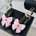 CHANEL Double C Big Bow Pearl Chain Sandals Light Pink Black Lambskin