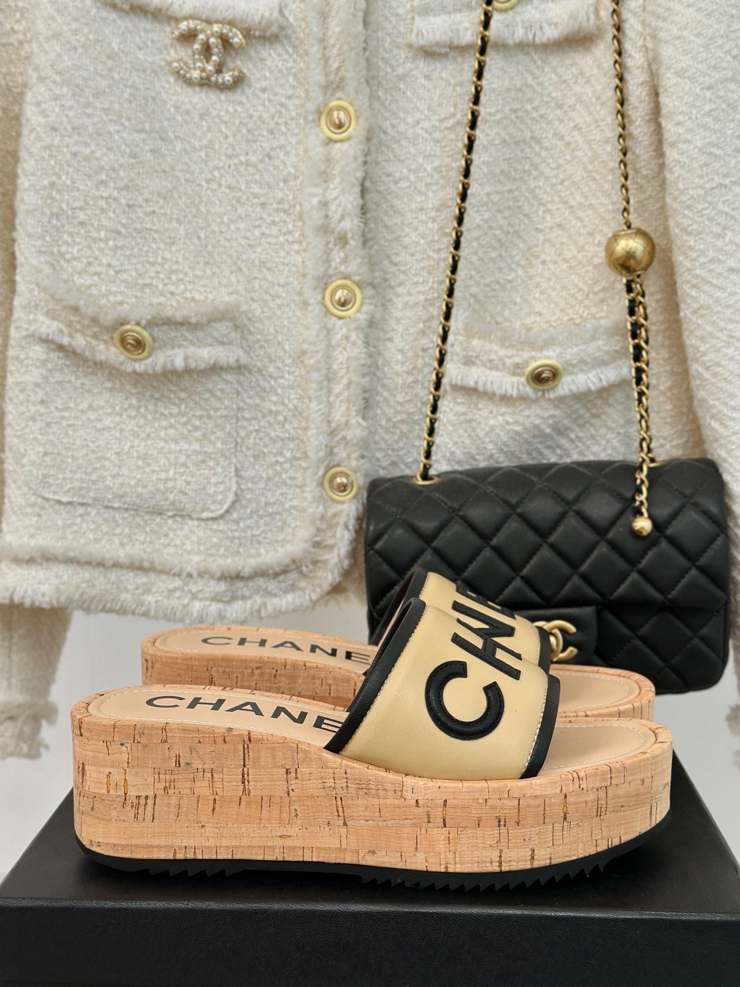 CHANEL THICK SOLE LETTER SLIPPERS IN DARK CREAM SHEEPSKIN
