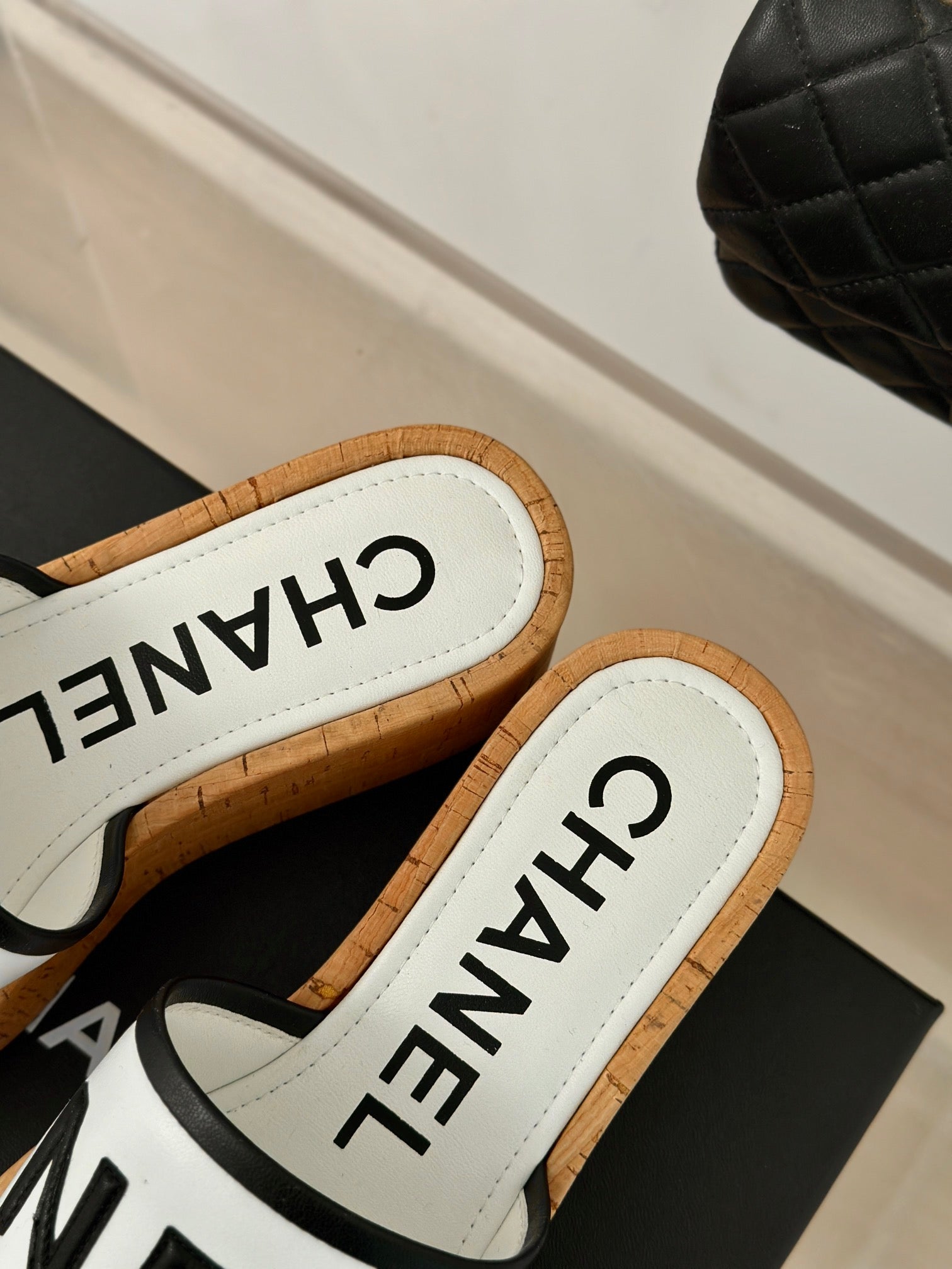 CHANEL THICK SOLE LETTER SLIPPERS IN WHITE SHEEPSKIN