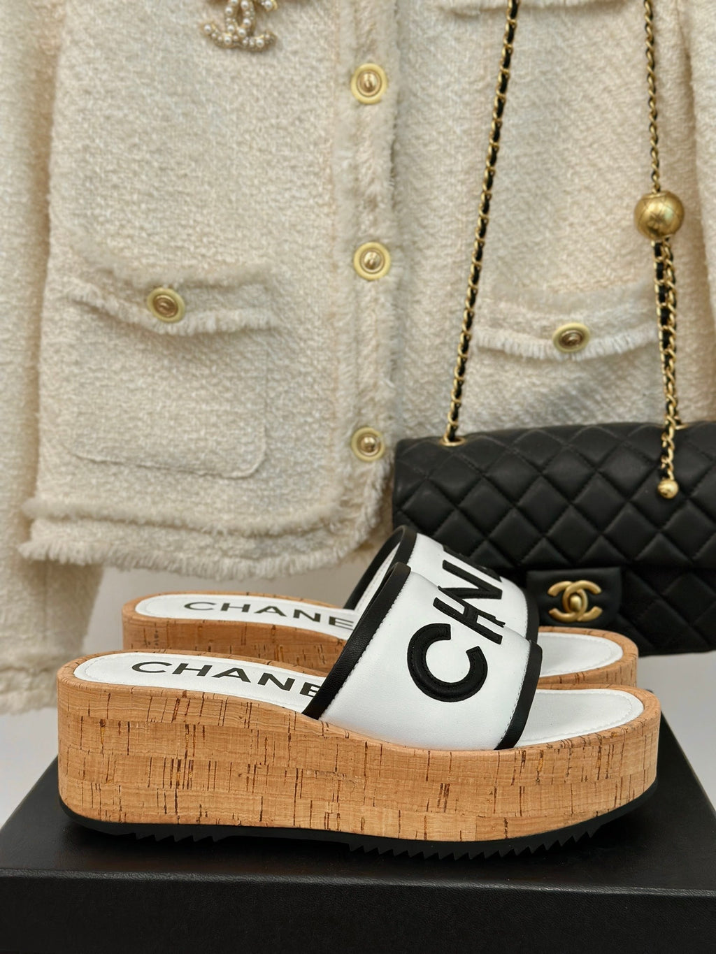 CHANEL THICK SOLE LETTER SLIPPERS IN WHITE SHEEPSKIN