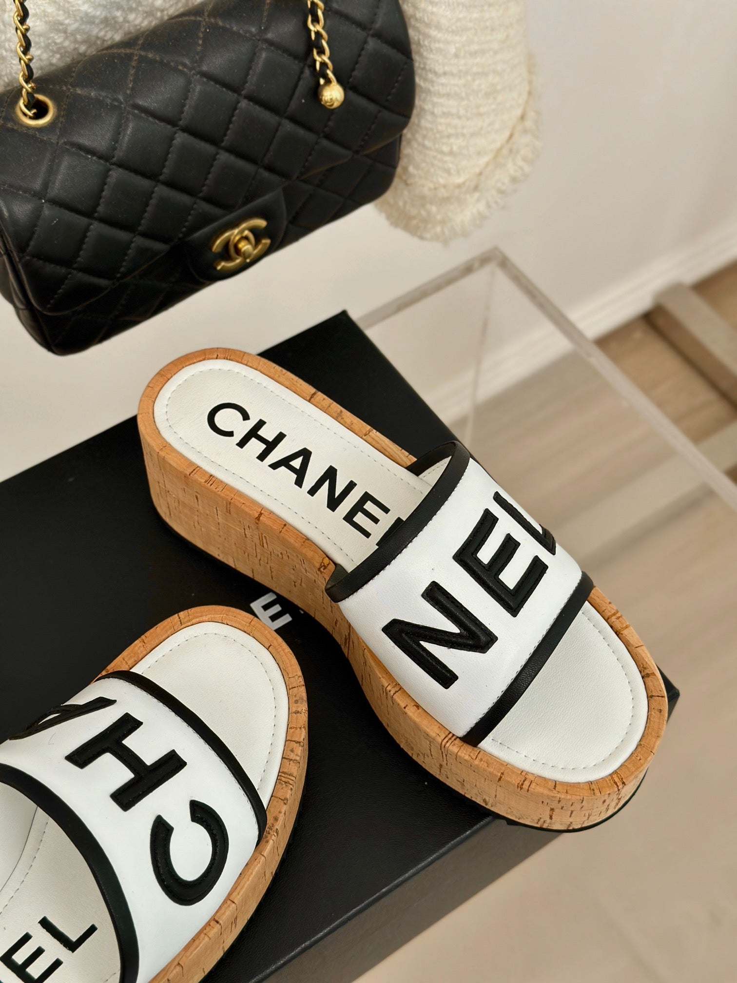 CHANEL THICK SOLE LETTER SLIPPERS IN WHITE SHEEPSKIN
