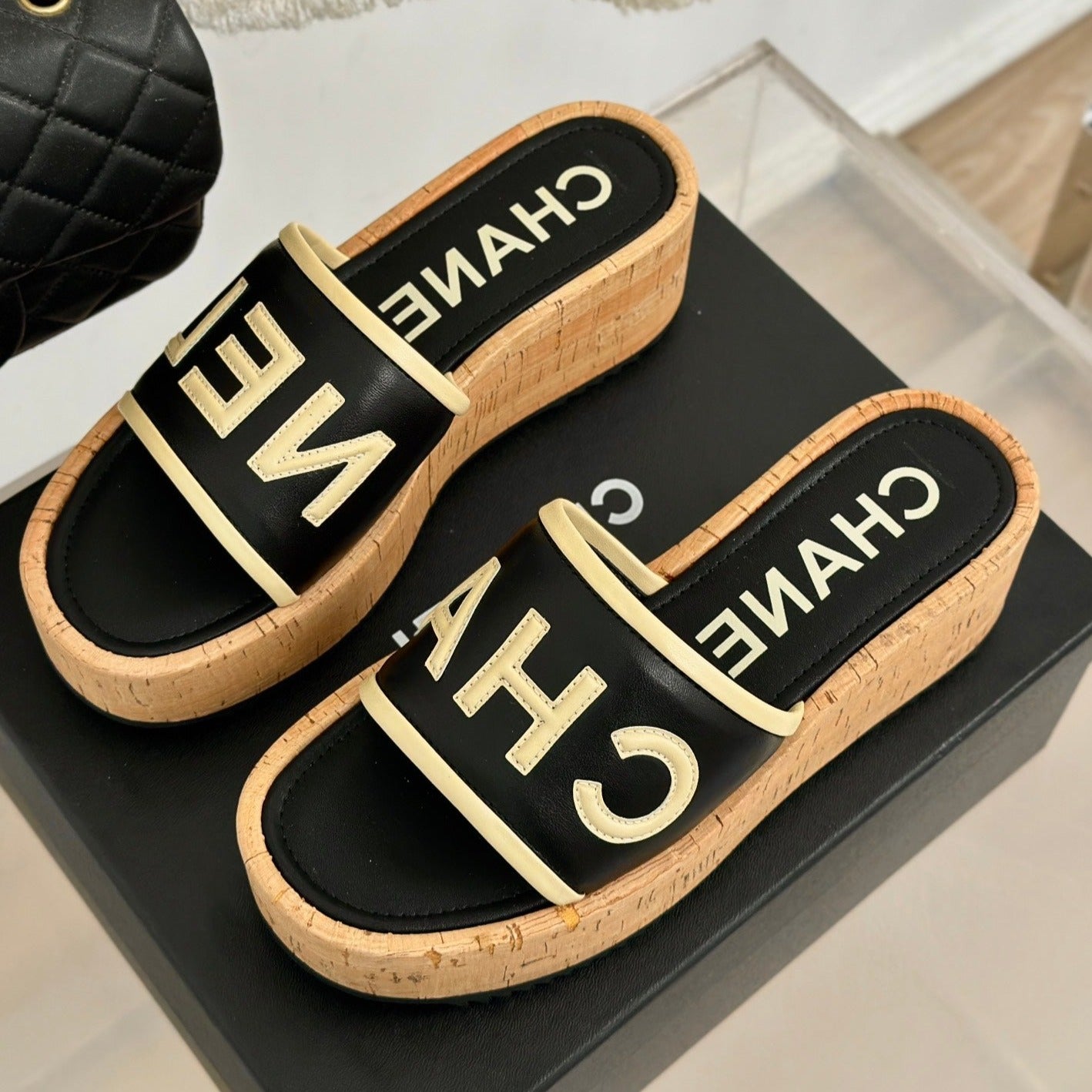 CHANEL THICK SOLE LETTER SLIPPERS IN BLACK SHEEPSKIN