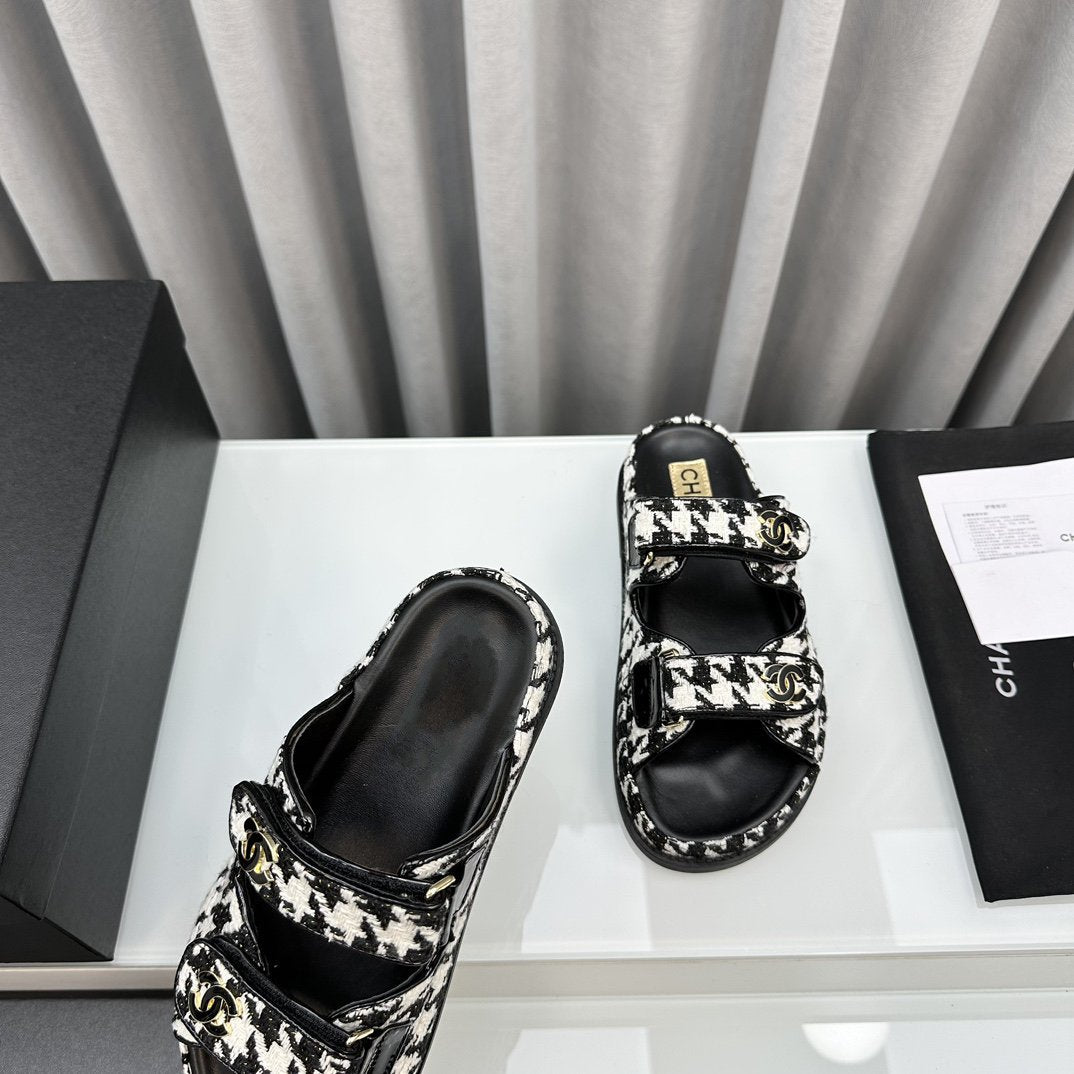 CHANEL dad sandals black white mules