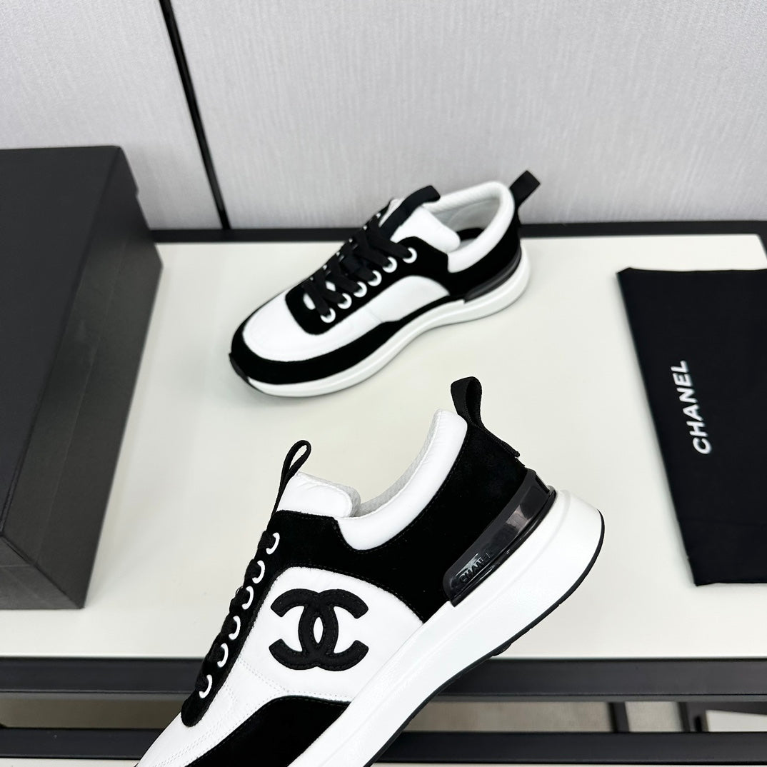 CHANEL SNEAKER IN BLACK SUEDE AND WHITE CALFSKIN