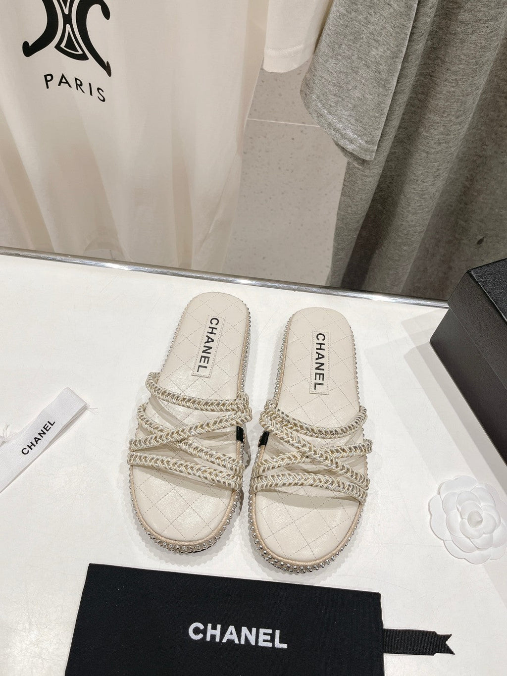 CHANEL WOVEN STRAP SLIPPERS IN WHITE LAMBSKIN