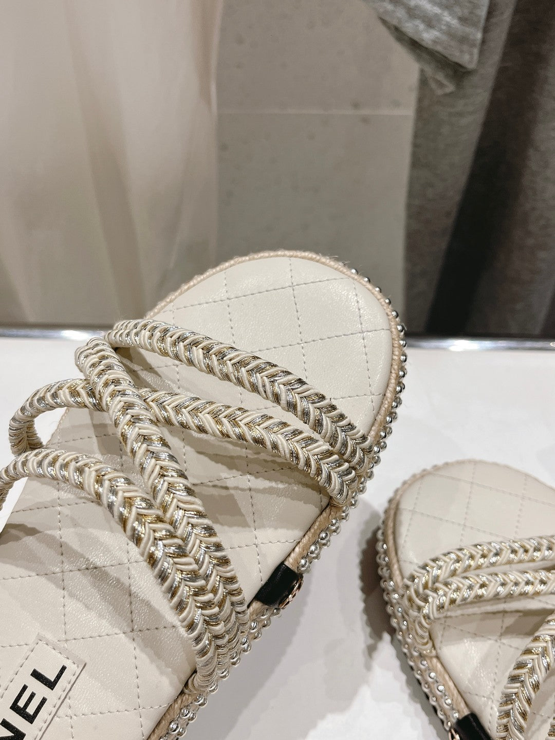 CHANEL WOVEN STRAP SLIPPERS IN WHITE LAMBSKIN