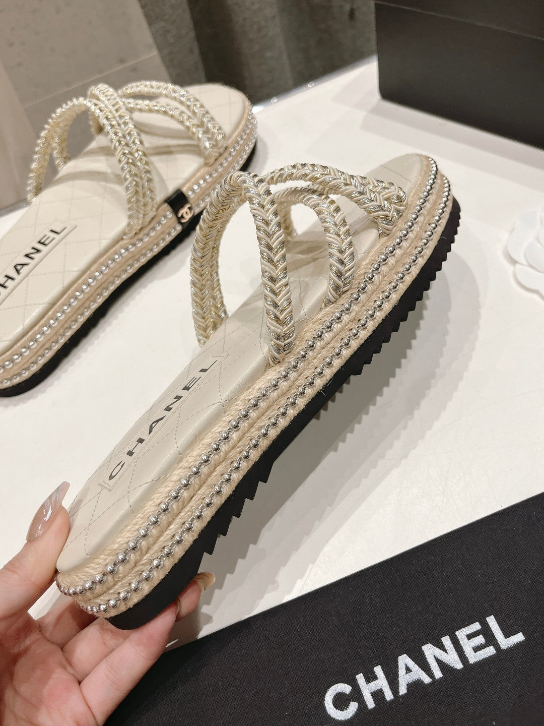 CHANEL WOVEN STRAP SLIPPERS IN WHITE LAMBSKIN