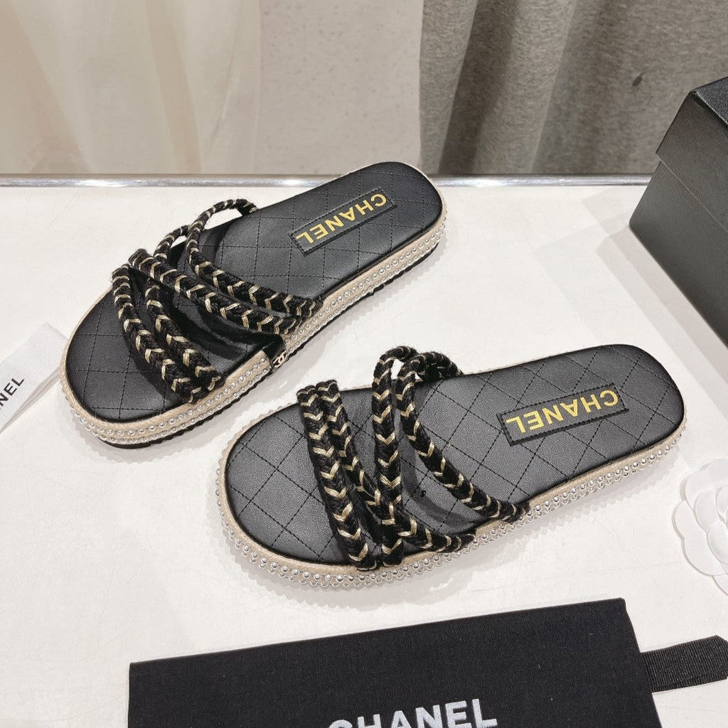 CHANEL WOVEN STRAP SLIPPERS IN BLACK LAMBSKIN